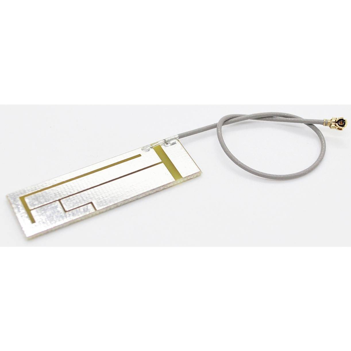 En flad rektangulær elektronisk antenne eller sensor på et kabel, vist på en hvid baggrund.