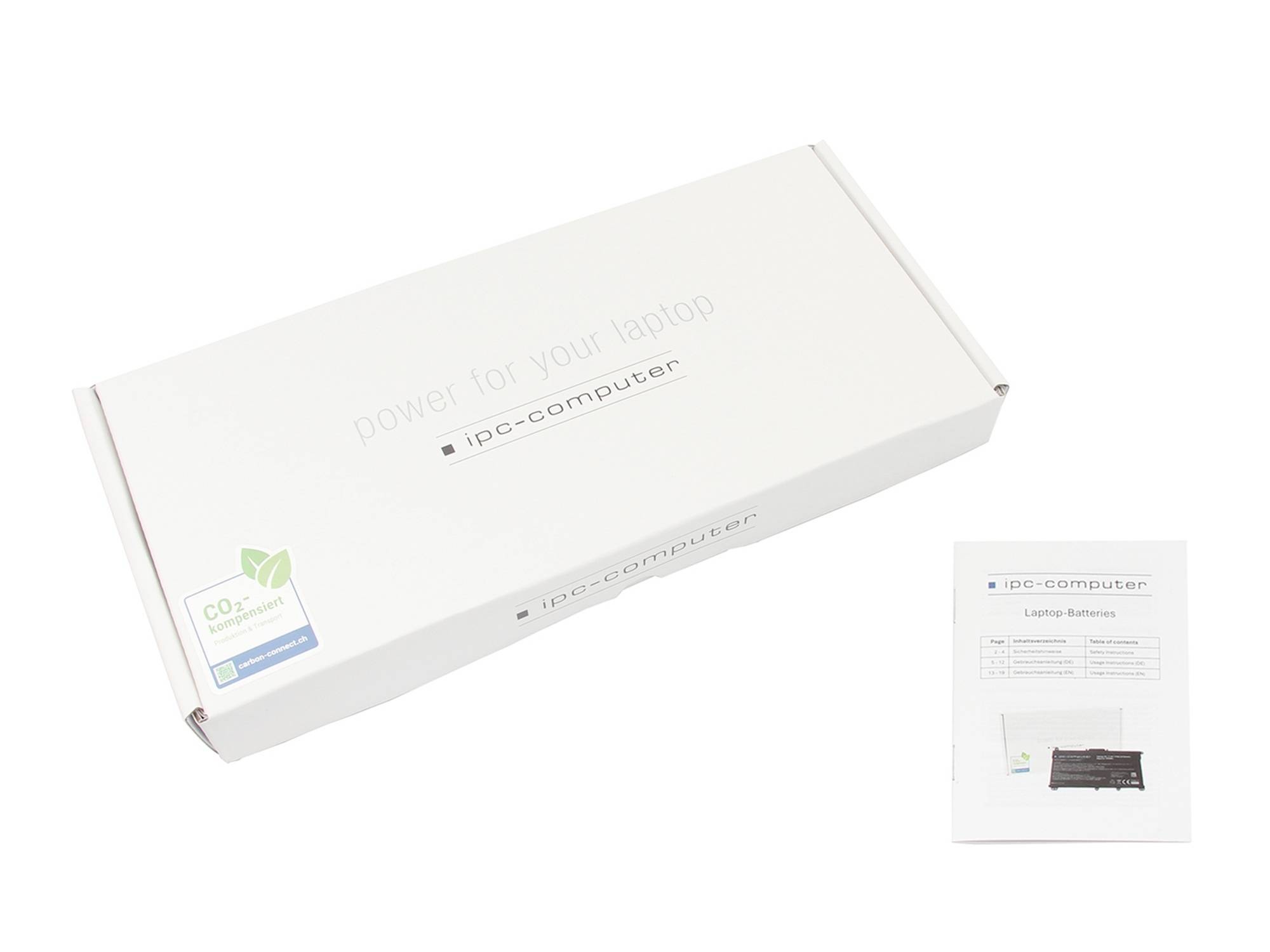 Hvid IPC-Computer bærbar batteriæske med en lille instruktionsfolder ved siden af på en enkel baggrund.