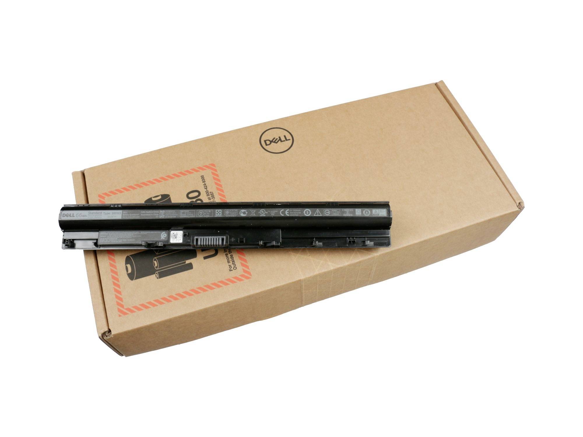 Et Dell-laptopbatteripakke ligger oven på en papkasse fra Dell på en hvid baggrund.