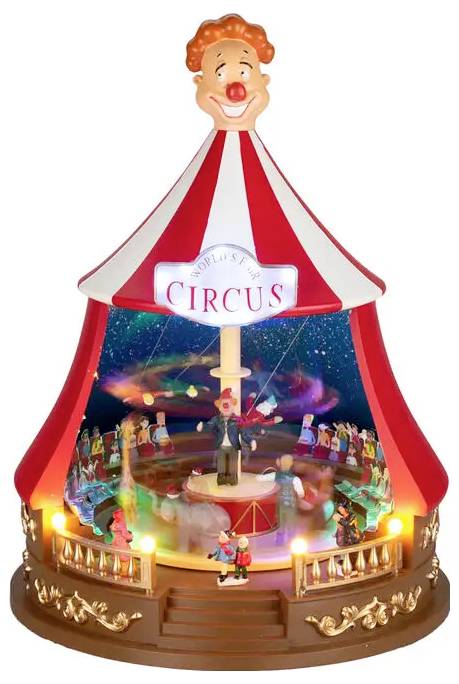 Dekorativ cirkusteltmusikdåse med klovnehoved-top, glødelamper og små kunstnere på en scene mærket 'CIRCUS'.