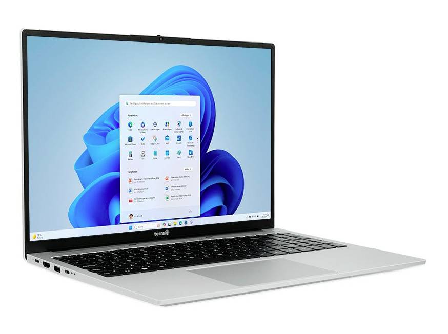 Sølvfarvet bærbar computer, der viser Windows 11-skrivebordet og Startmenuen på en blå abstrakt baggrund.