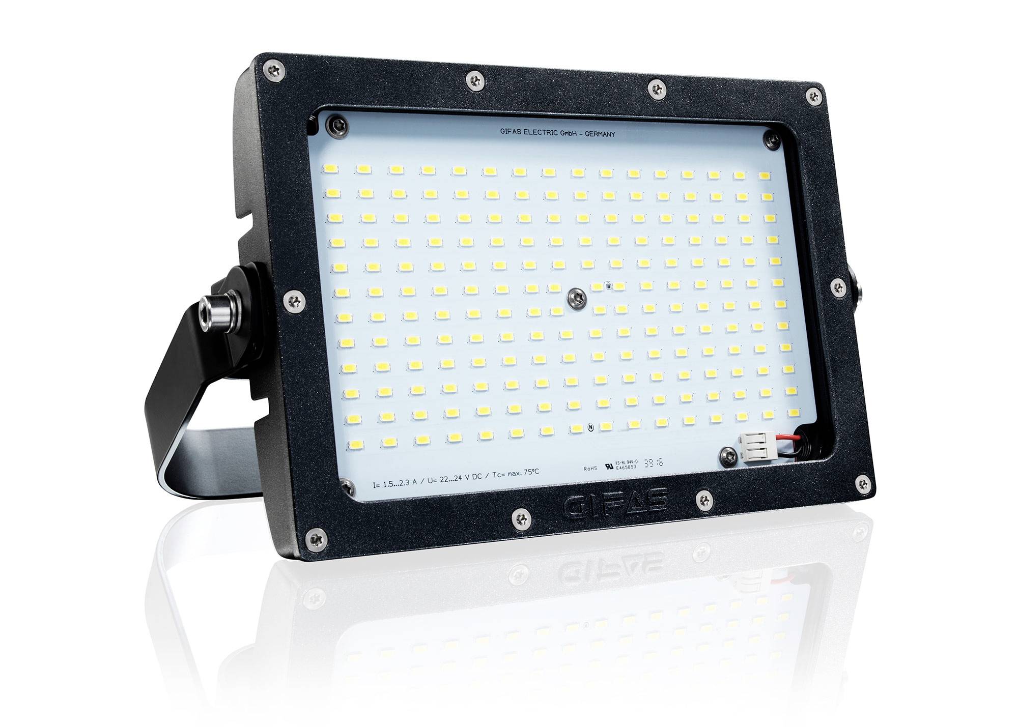 Sort LED-projektørarmatur med monteringsbøjle og rækker af små gule LED'er på et hvidt panel mod en ensartet baggrund.