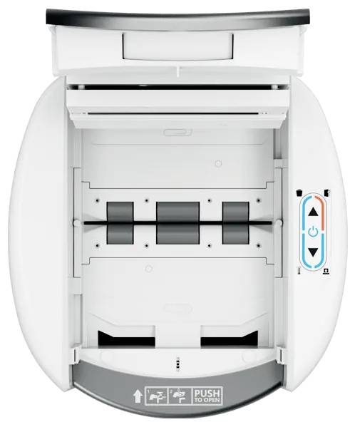 Interiør af en hvid kontorprinter eller kopimaskine, der viser papirstien og kontrolknapper med pil op og ned.