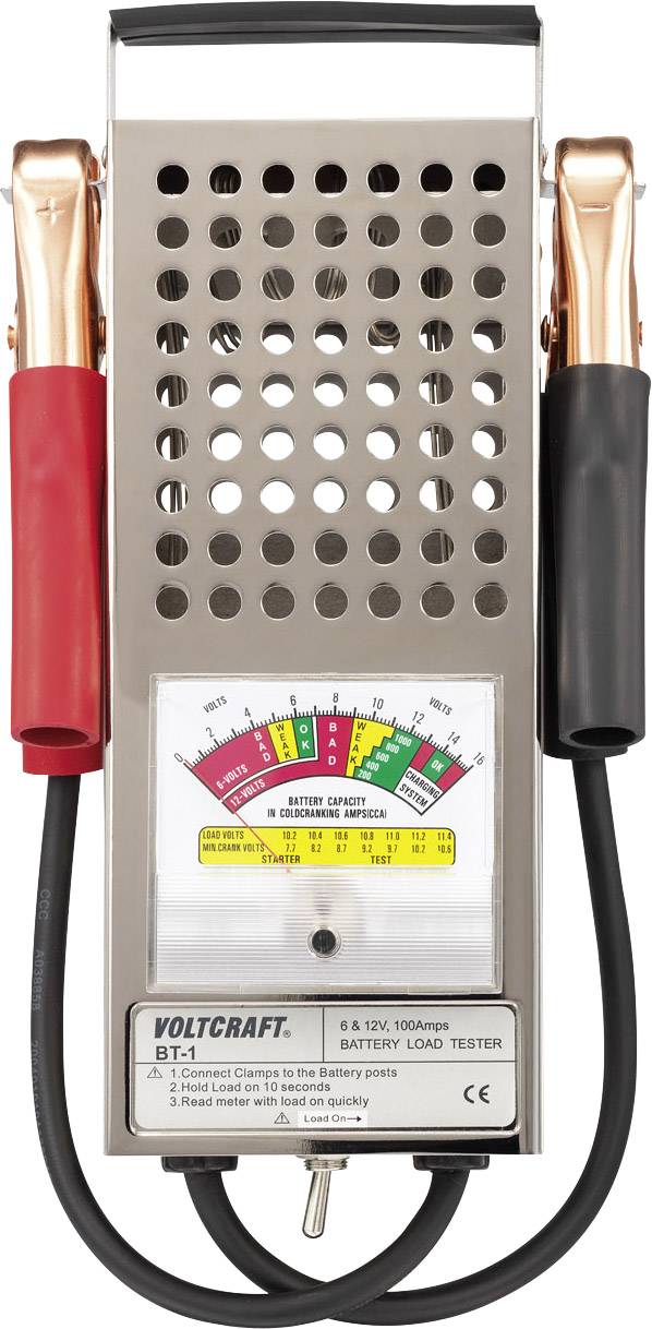 En batteritester med et analogt måleapparat, rød og sort klemme på venstre og højre side, viser batteriens opladningstilstand.