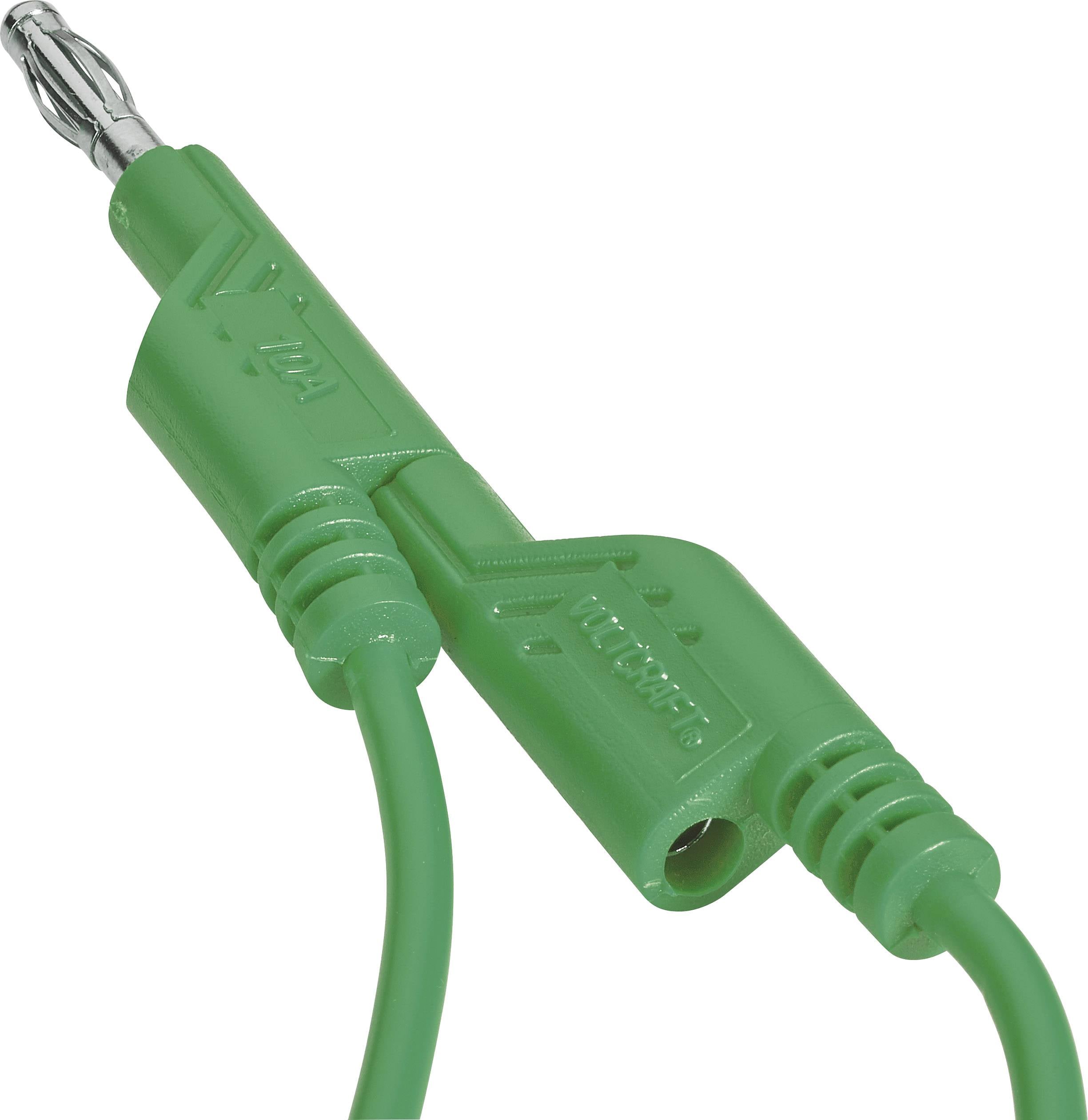 Et grønt bananstik-kabel med isoleret stik og markeret polaritet, bruges til elektriske forbindelser i laboratorier.