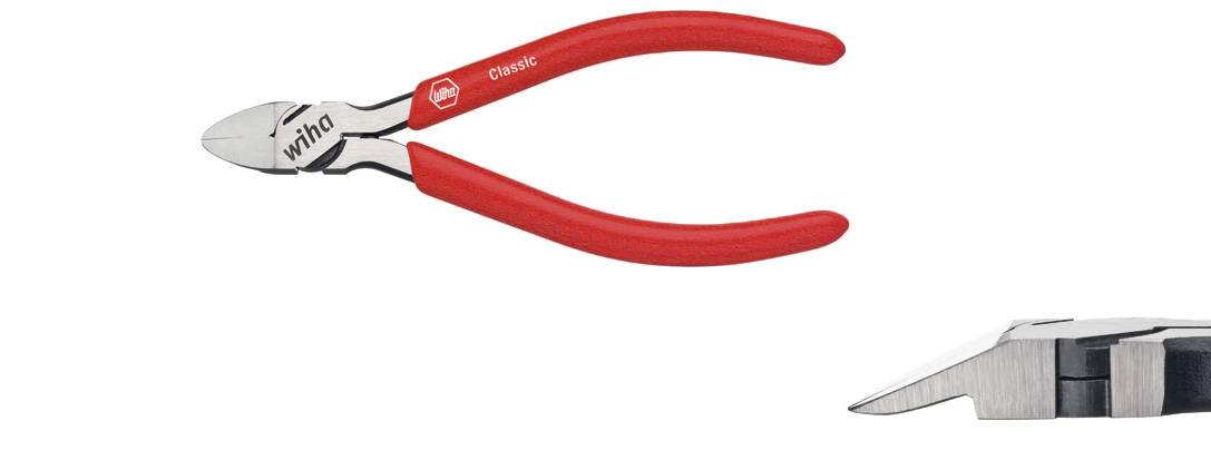 'Wiha Classic' sidebidertang med røde greb, egnet til at klippe tråd eller kabler. Nærbillede af de præcise skæreblades.