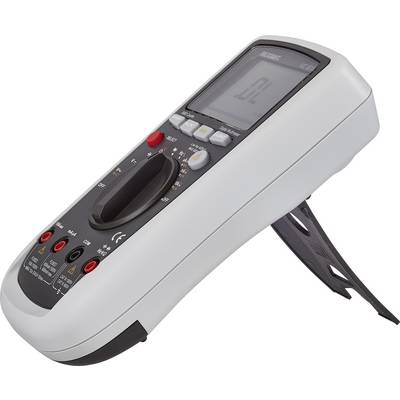 Et digitalt multimeter, der står på en skrå hylde. Det viser et symbol på skærmen. Betjeningsknapper og tilslutninger er synlige.