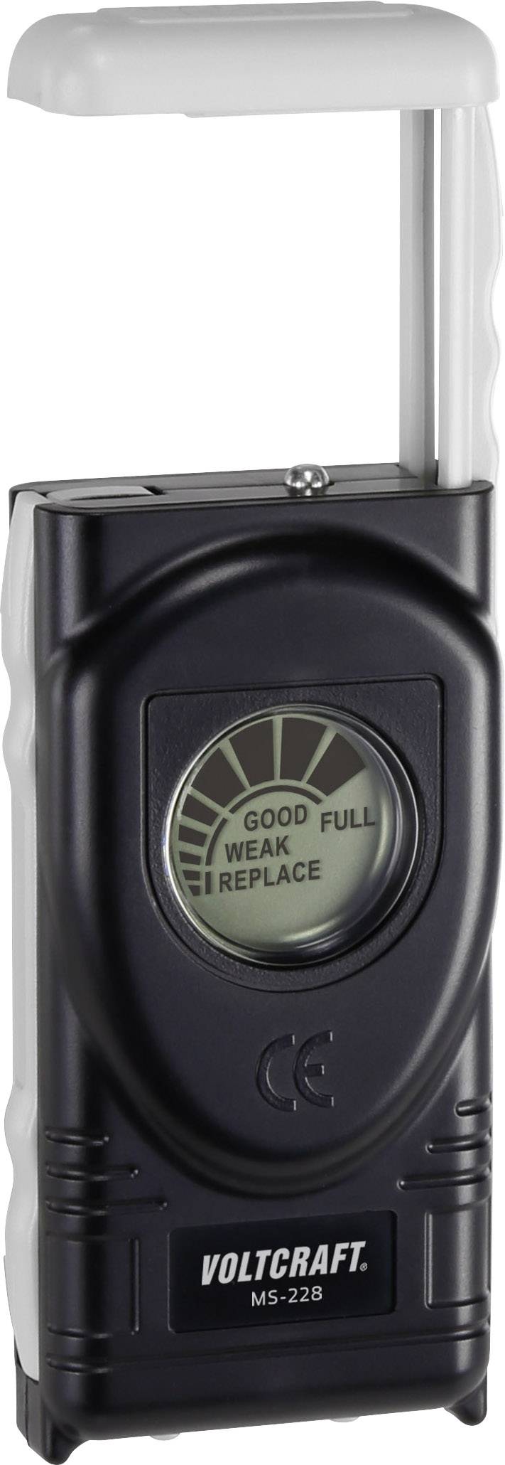 Et sort batteritestapparat med display, der viser 'God', 'Fuld', 'Svag', 'Udskift'. Mærkenavnet 'Voltcraft' trykt forneden.