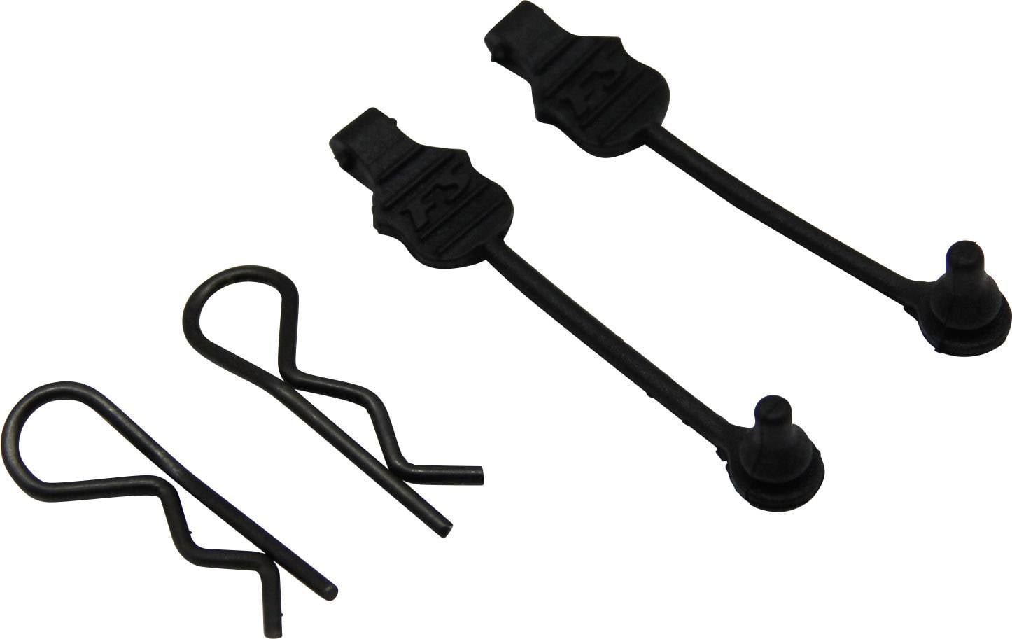 To svarte sikringsstifter og to splitbøsninger af metal; reservedele til cykelkomponenter.