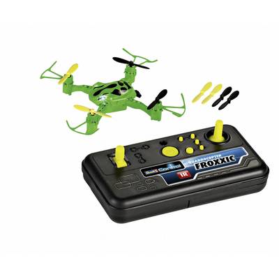 Grøn mini-quadkopter med sorte og gule propeller, ved siden af en sort fjernbetjening med gule knapper.
