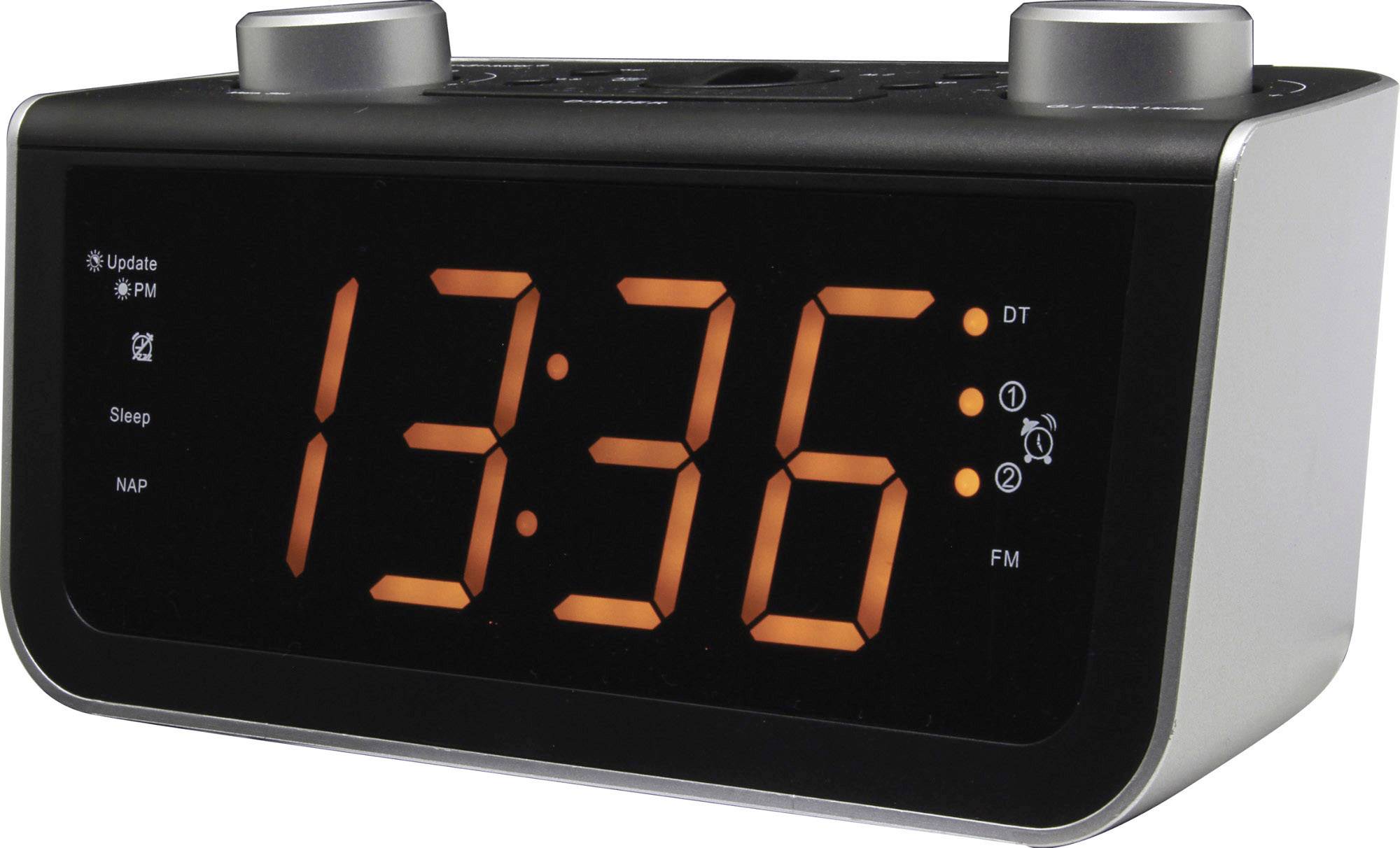 Digital vækkeur med stor, lysende display, der viser '13:36'. Knapper øverst til styring af funktioner som FM-radio, alarm og snooze.