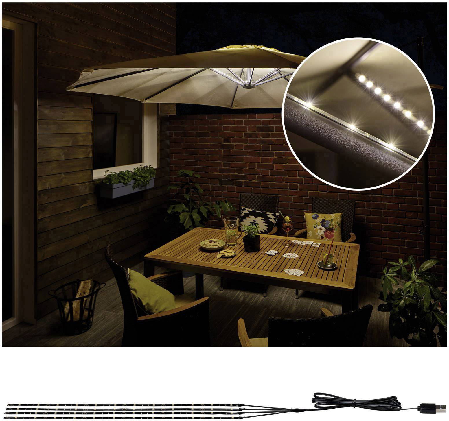 Hyggelig terrasse-bord om natten, belyst af LED-lys under en parasol. Nærbillede af LED-striberne i en cirkel.