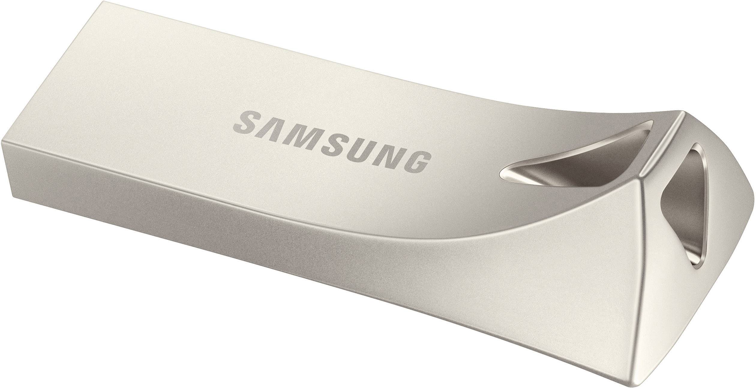 USB-stik i metal med 'SAMSUNG'-logo, rektangulær form, buet kant og nøglering.
