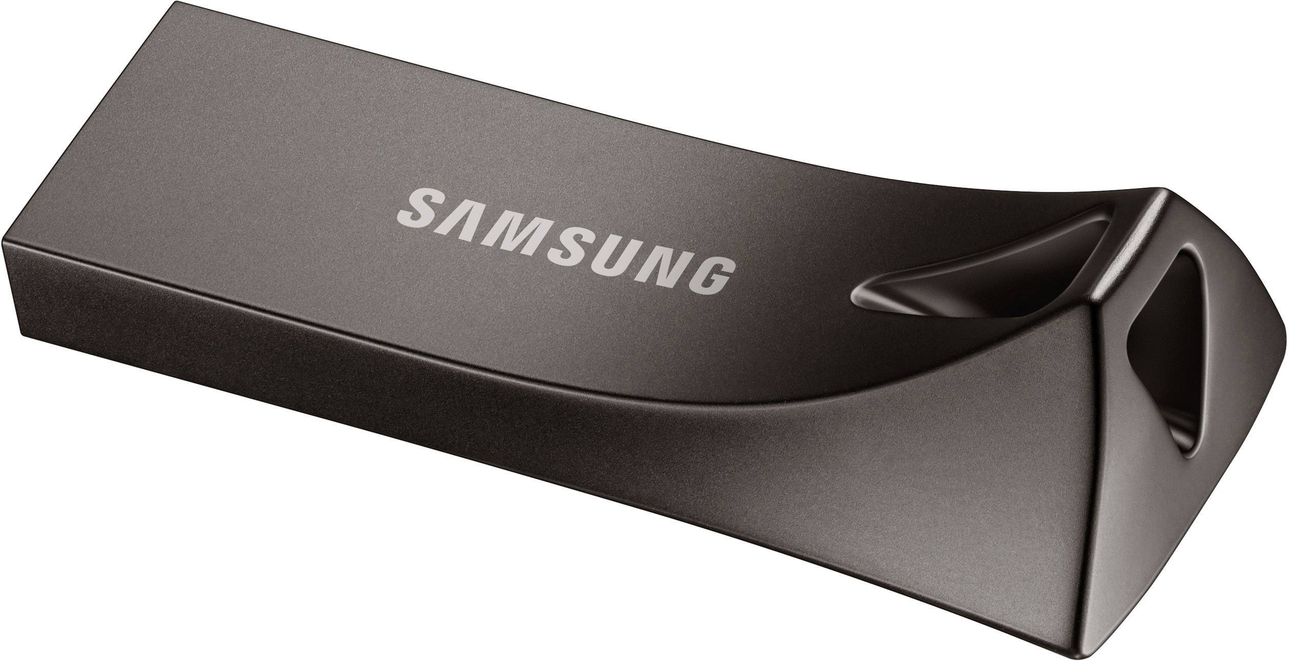 En sort USB-stick med 'Samsung'-logo, let blankt overflade, moderne og kompakt design.