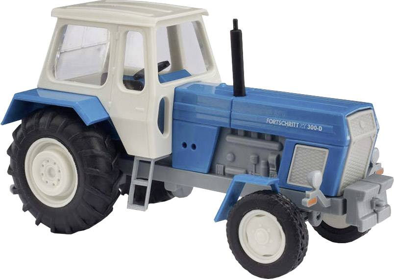 Legetøjsmodel af en traktor 'Fortschritt ZT-300-D' i blå og hvid, med store sorte dæk og vinduer i kabinen.