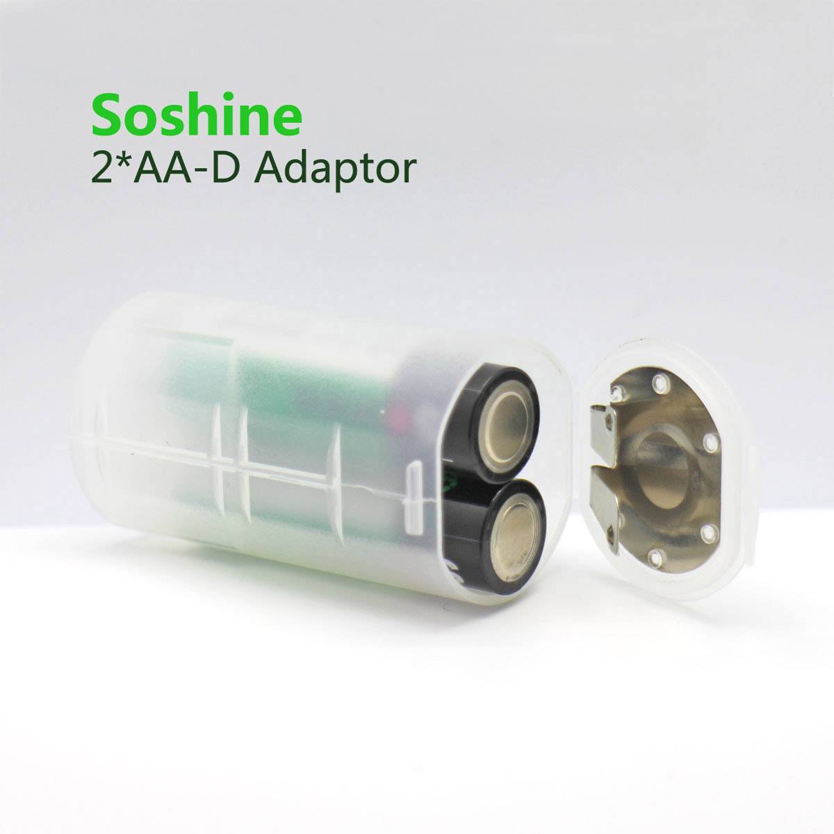'Adapter til to AA-batterier i D-format, transparent. Mærke: Soshine. Batteriholder i plast, åben.'
