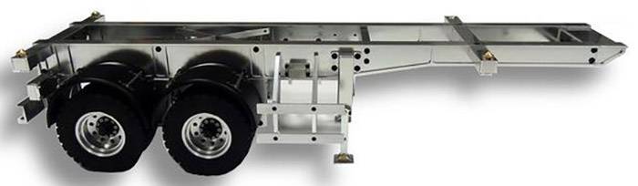 Metalramme på et erhvervskøretøjsanhænger med to store gummihjul.