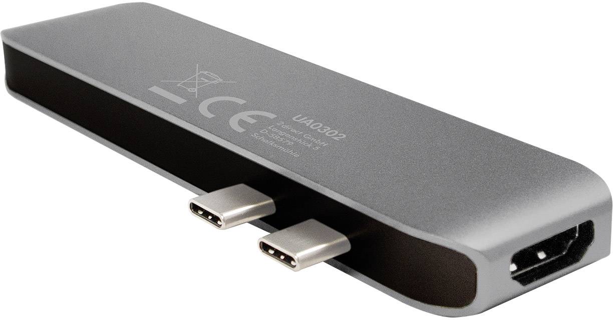 En sølvfarvet USB-C-hub med to USB-C-porte og en HDMI-port. Formål: Udvidelse af tilslutningsmuligheder for enheder.