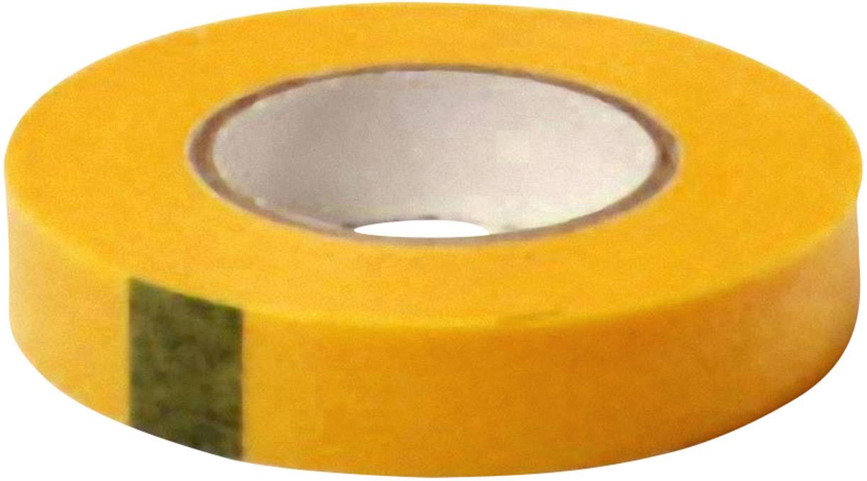 En rulle gult tape med en grå klæbende overflade i midten, liggende på en hvid overflade.