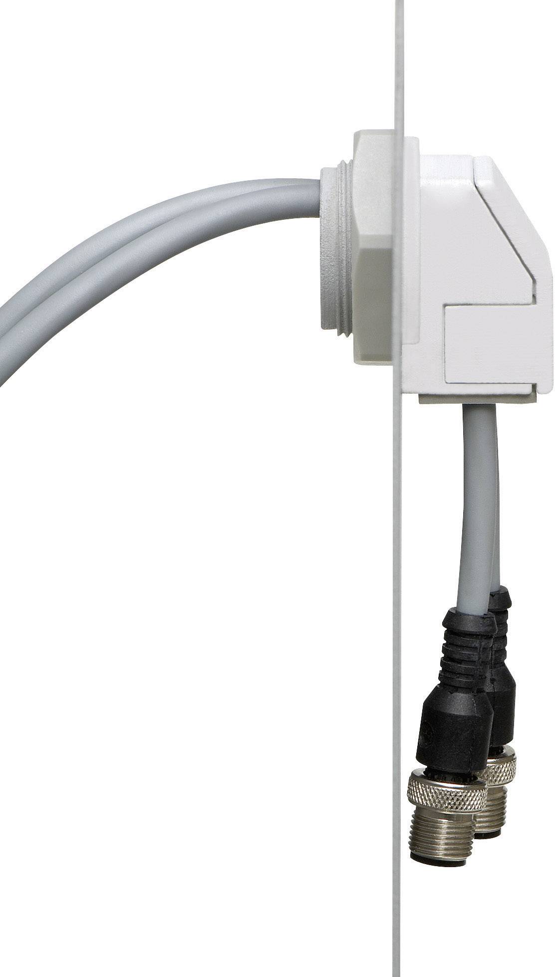 Kabelgennemføring med hvidt hus, fastgjort på en væg. To koaksialkabel er tilsluttet.