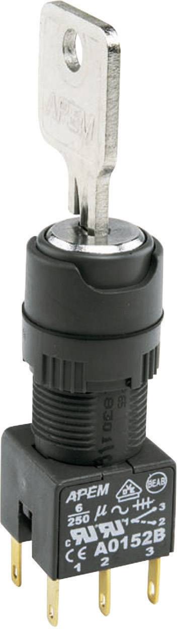 Nøgleomskifter med seks ben, sort kabinet og metallic nøgle. Mærkninger: 'APEM', '6A 250V', 'AO1526'.