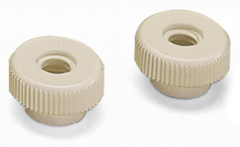 To elfenbensfarvet, rillede plastikdrejningsknapper, placeret ved siden af hinanden på en hvid baggrund.