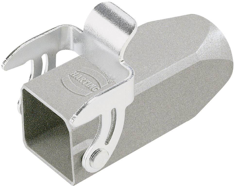 En grå, metalagtig komponent med en firkantet åbning og en foldbar metalmekanisme på oversiden.