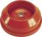 Et rødt plastlåg med cylindrisk design og et lille hul i midten, placeret på en plan overflade.