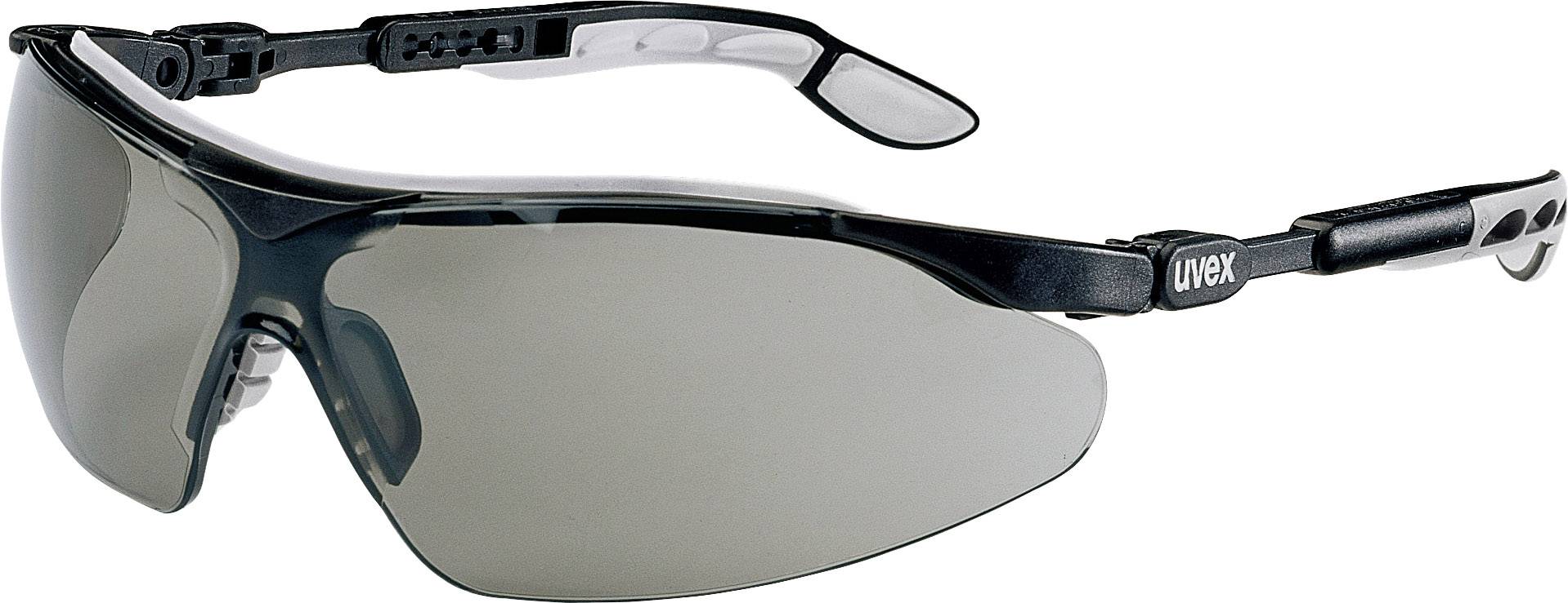 Beskyttelsesbrille med tonede glas og justerbar ramme, egnet til brug som øjenbeskyttelse i arbejdsmiljøer.