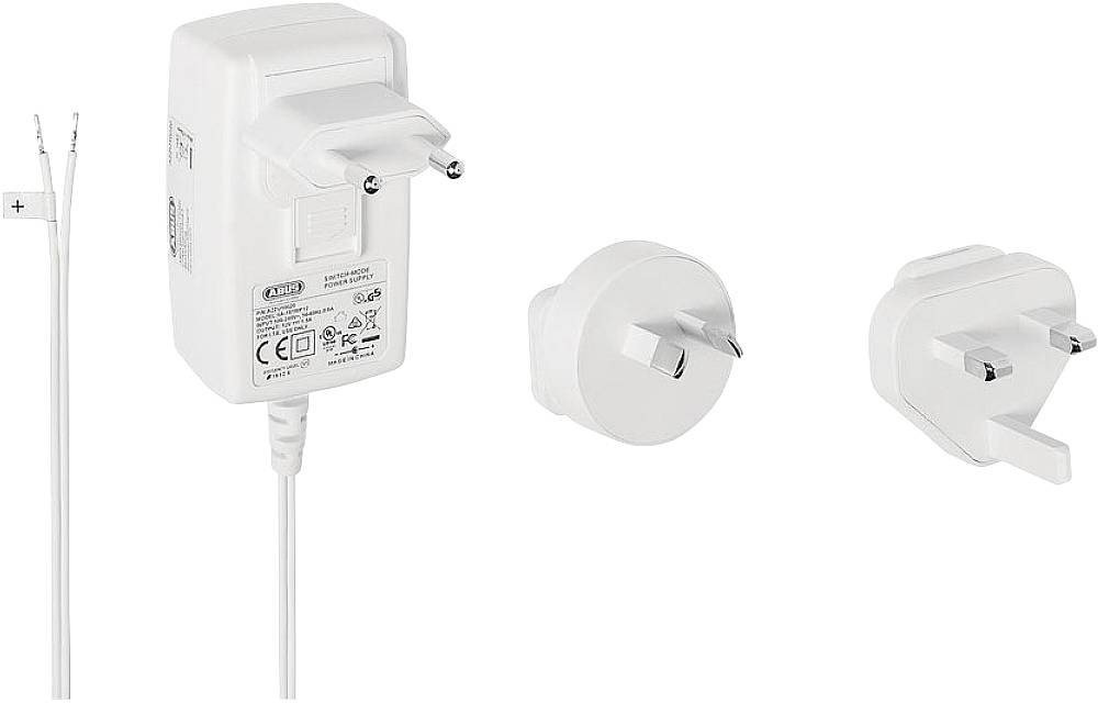 Netzteil mit austauschbaren Steckern für verschiedene Länder. Enthält Kabel mit offenen Enden für Plus- und Minuspol.