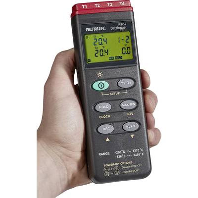 Hand hält ein digitales Thermometer mit mehreren Knöpfen und einem Display, das Temperaturwerte anzeigt. Gerät von Voltcraft, Modell K204.