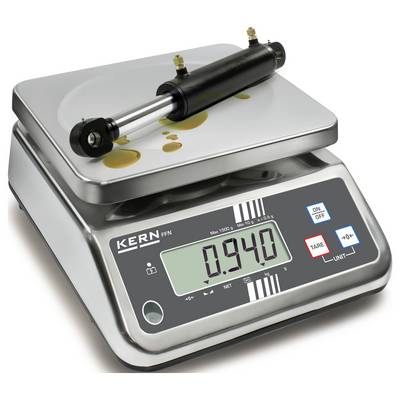 'Ein zylindrisches Metallteil liegt auf einer digitalen Waage und zeigt ein Gewicht von 0,940 kg an.'