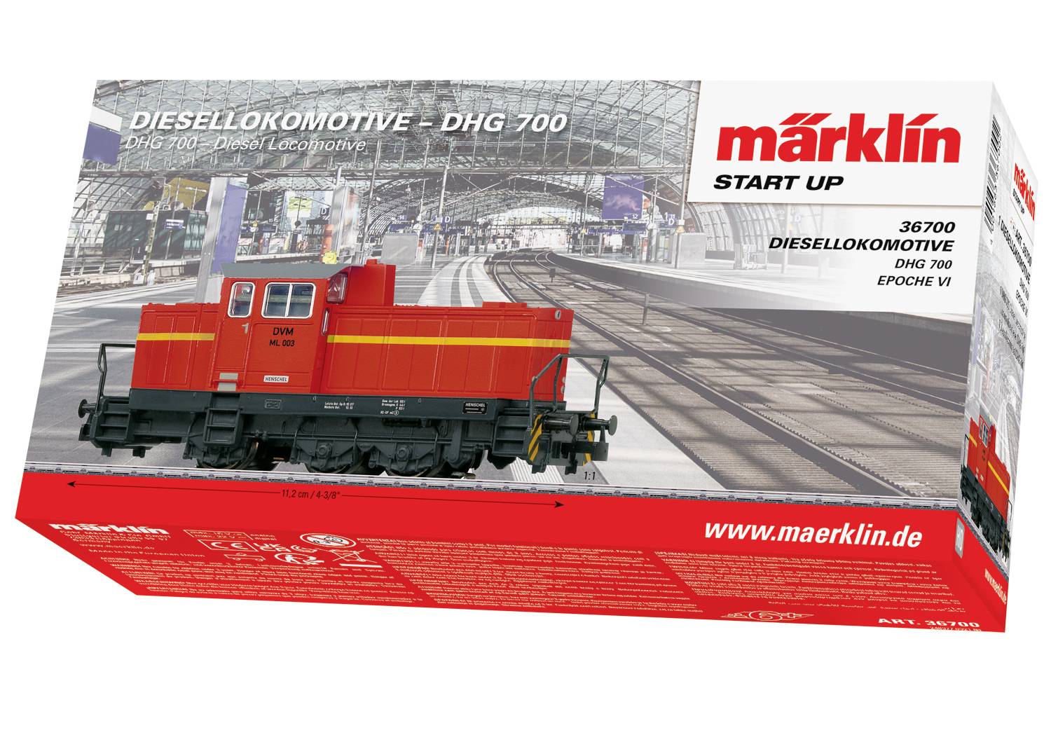 Die Verpackung zeigt ein Modell einer roten Diesellokomotive DHG 700 von Märklin auf einem Bahnhofshintergrund, markiert als "START UP".