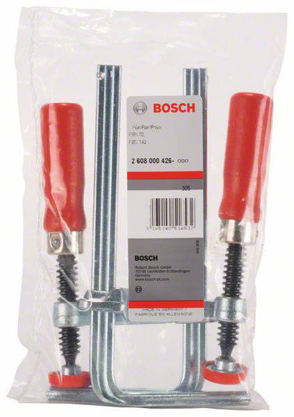 Klemmschiene mit roten Griffen und Metallrahmen, verpackt in Klarsichtfolie. Bosch-Label mit Produktnummer und Markendetails sichtbar.