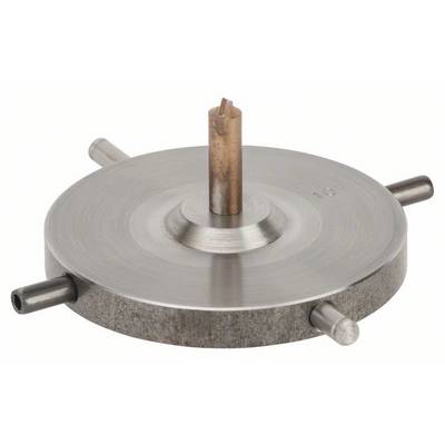 Rundes Metallteil mit vertikalem Mittelstift und vier horizontalen Anschlüssen am Rand, wahrscheinlich ein technisches Bauteil.