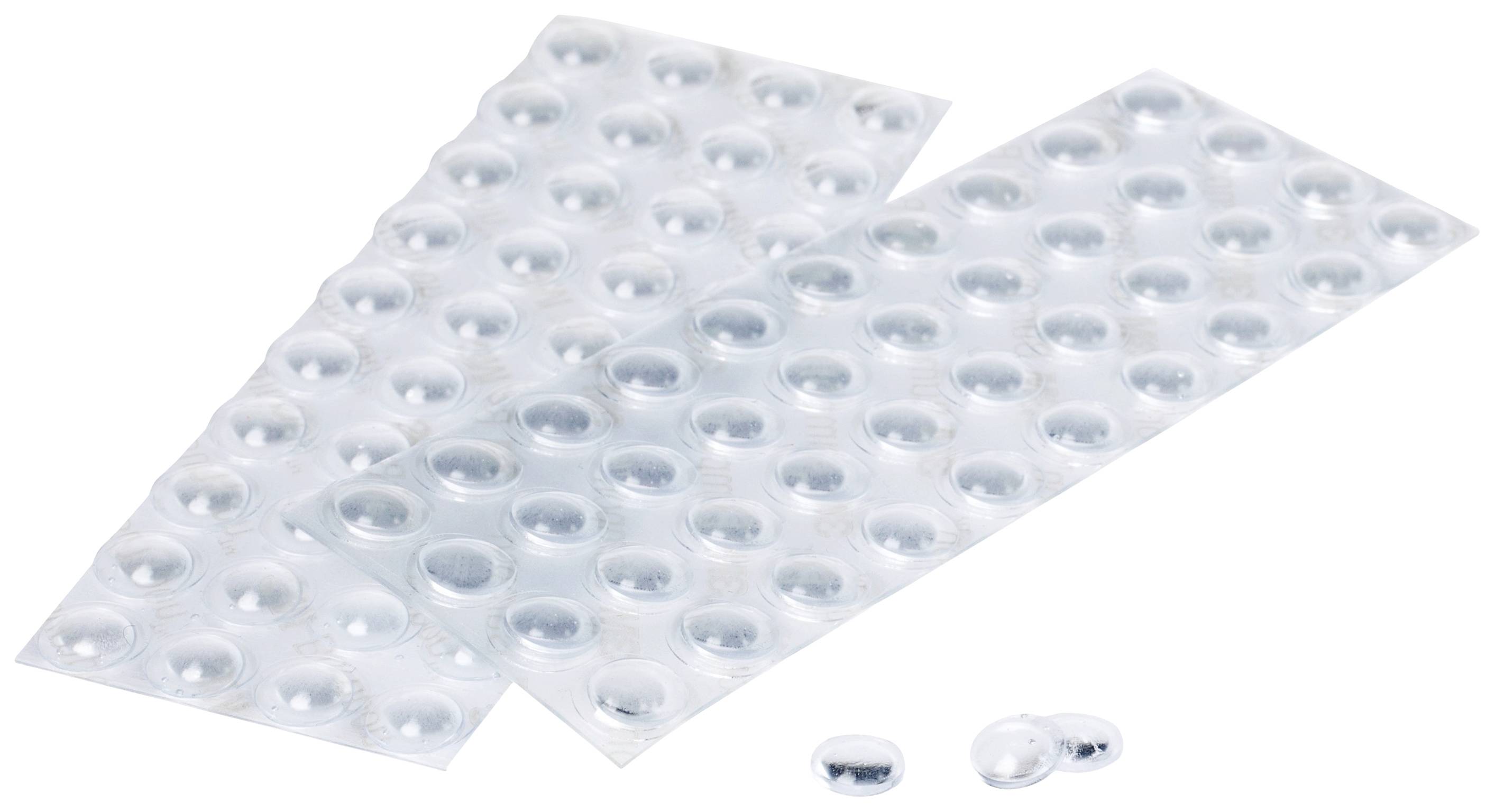 Zwei geöffnete Blisterpackungen mit Tabletten und zwei lose Tabletten auf einem weißen Hintergrund.