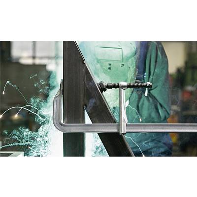 Ein Schweißer arbeitet an einem Metallstück, umgeben von Funken und hellem Licht. Er trägt einen Schutzhelm und Schutzausrüstung.