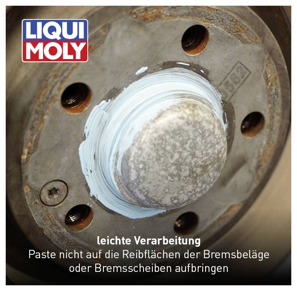 'Leichte Verarbeitung: Paste nicht auf die Reibflächen der Bremsbeläge oder Bremsscheiben aufbringen.' Nahaufnahme einer Autobremskomponente mit blauer Paste.
