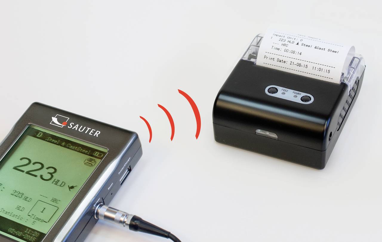 Messgerät empfängt Wireless-Daten von einem Drucker, mit Anzeige von '223' auf dem Bildschirm.