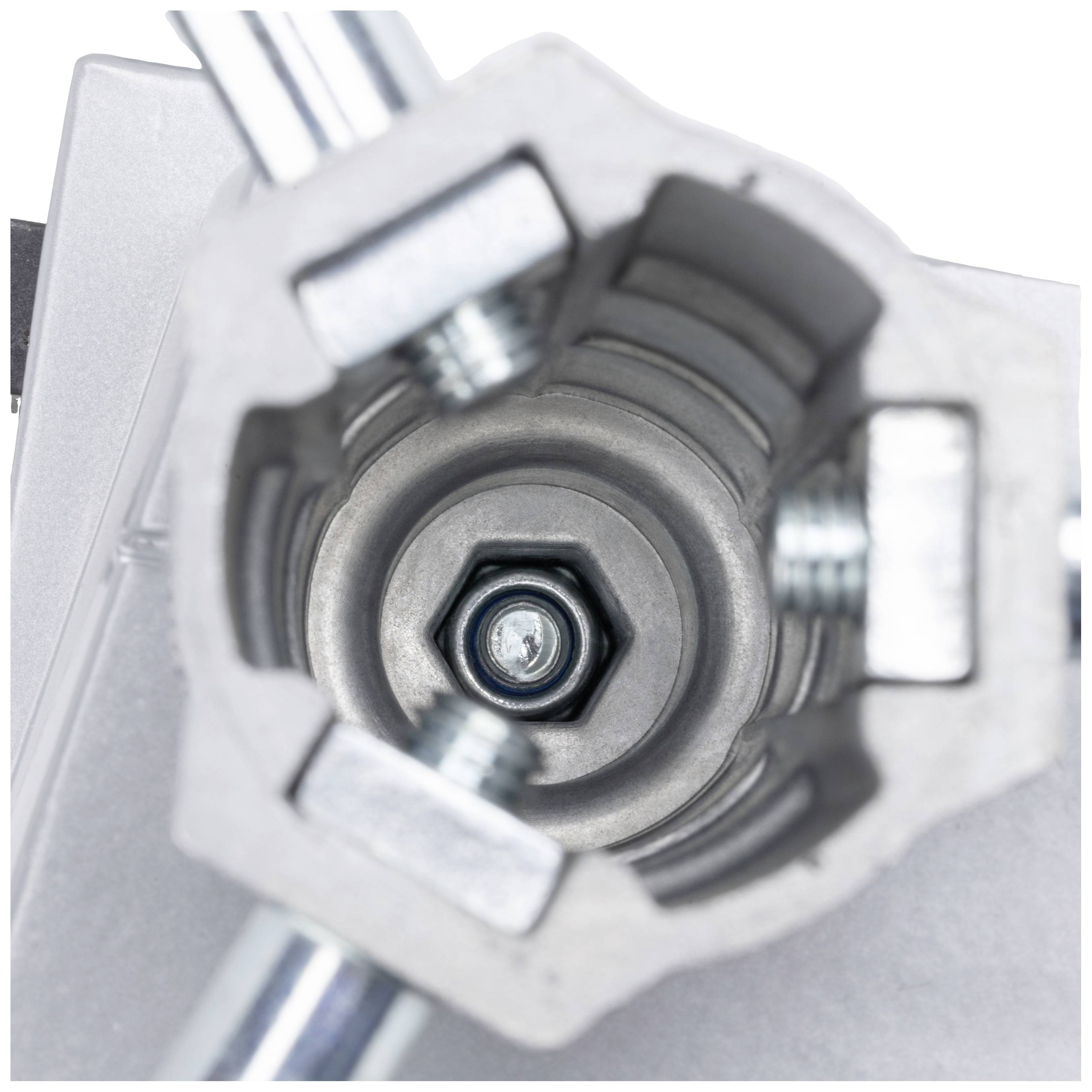 Ansicht von oben auf ein sechseckiges Metallteil mit Schrauben und Muttern, eingebaut in eine Maschine oder ein Gerät.