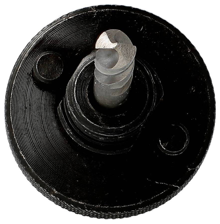 Nahaufnahme eines schwarzen kreisförmigen mechanischen Teils mit einer silbernen zentralen Schraube oder Welle auf weißem Hintergrund.