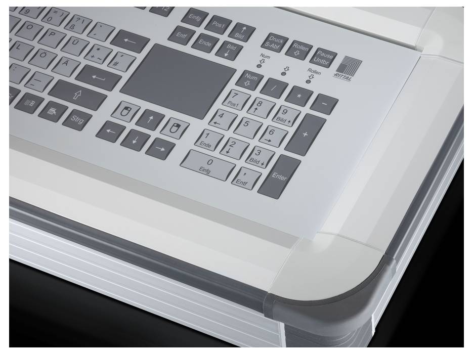 Computertastatur mit speziellen Tasten für Steuerung und Navigation, silbernes Design, ergonomisch geformt, auf dunklem Hintergrund.