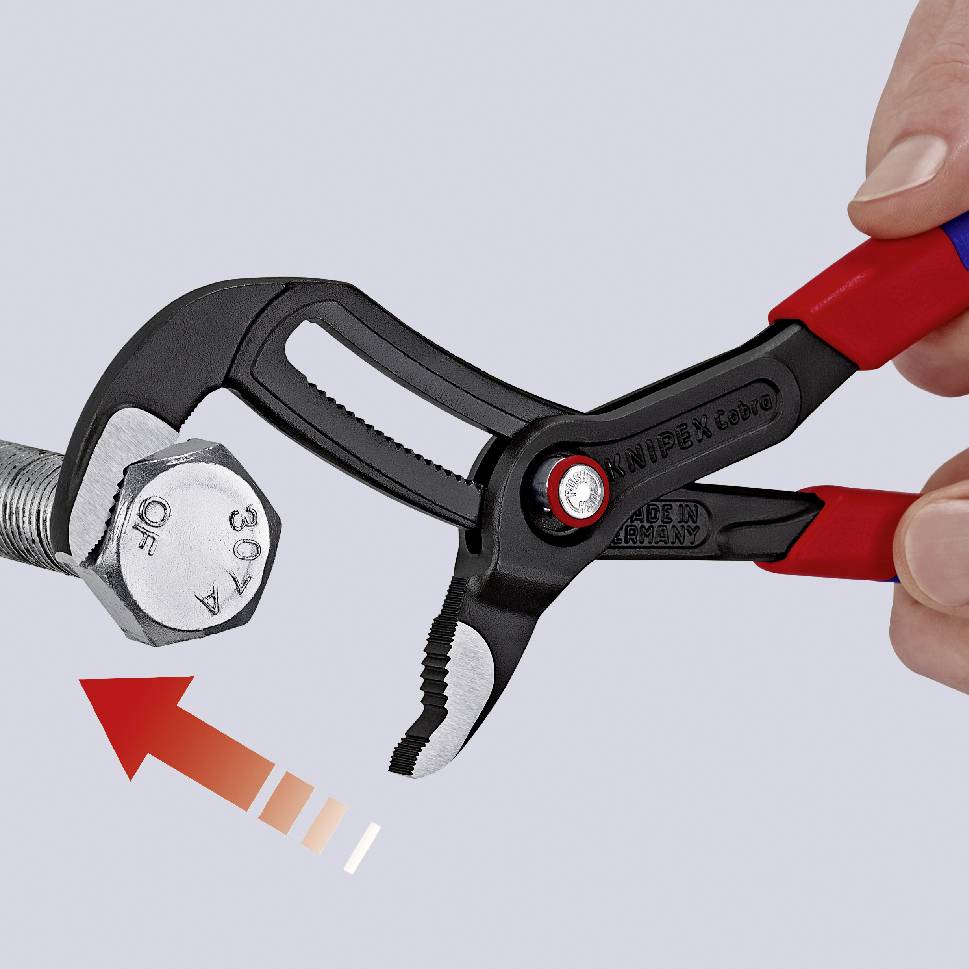 Eine rote Zange greift einen silbernen Schraubenkopf; Pfeil zeigt Torsionsrichtung an.
