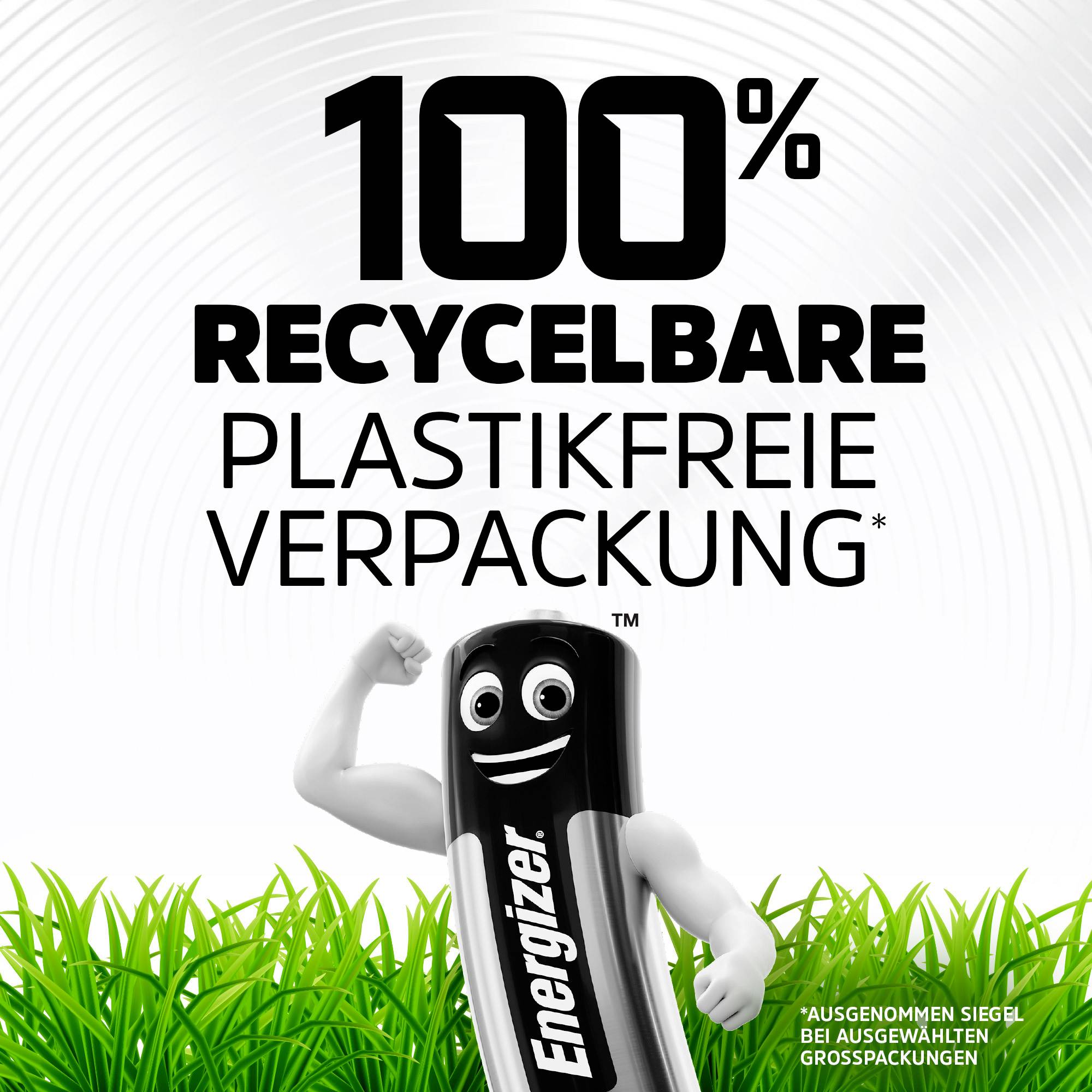 Batterie mit Gesicht steht auf grünem Gras, darüber der Text '100% recycelbare plastikfreie Verpackung'. Energizer-Markenlogo unten.