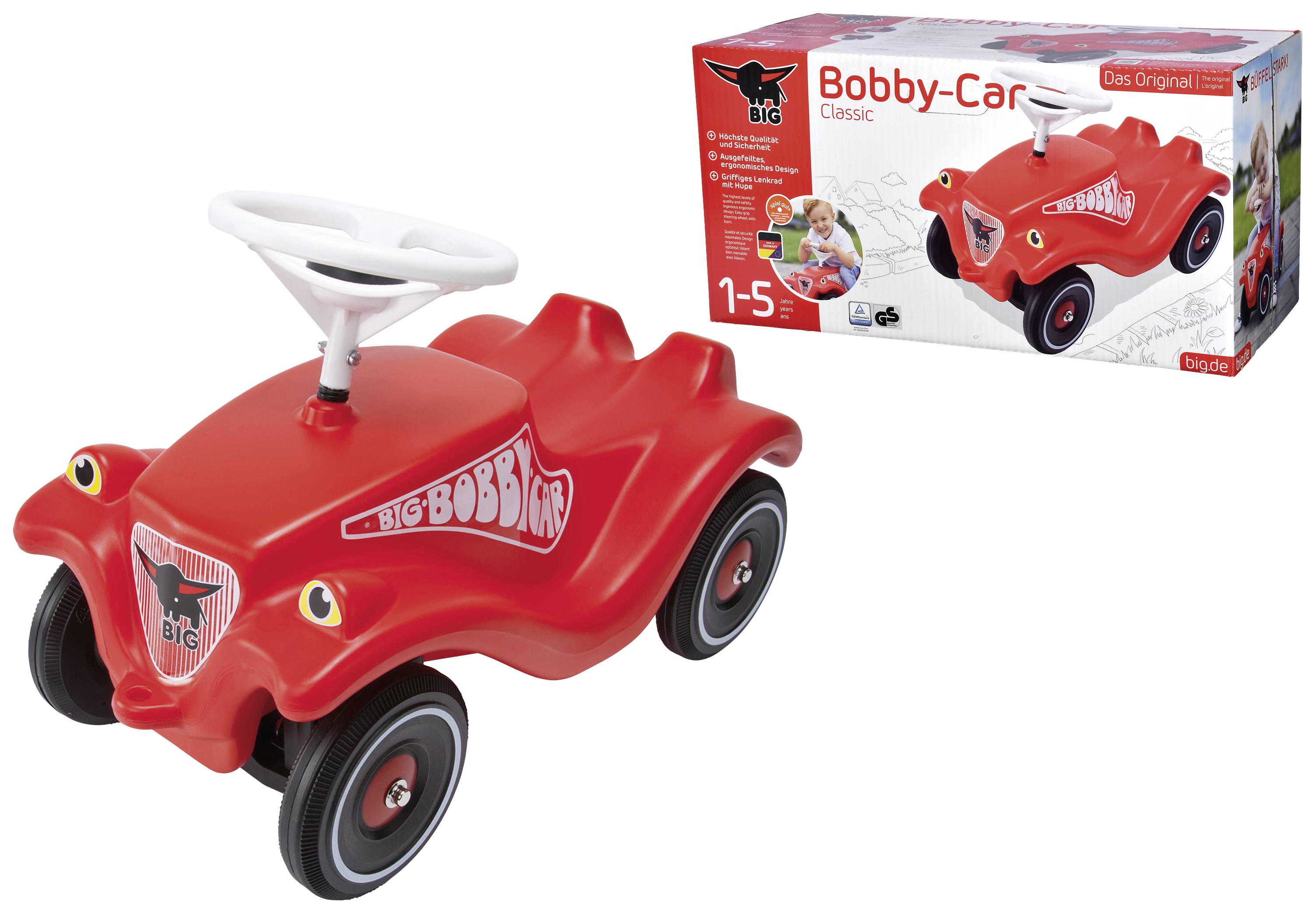 Rotes Bobby-Car mit weißen Lenkrad und Rädern. Abbildung der Verpackung zeigt ein Kind beim Fahren. Geeignet für Kinder von 1-5 Jahren.