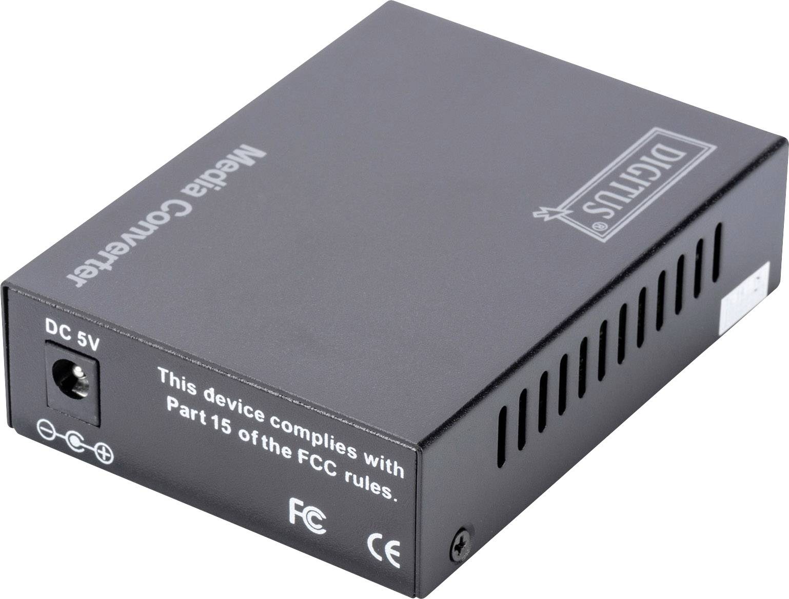 Schwarzer Medienkonverter mit Netzteilanschluss, Lüftungsschlitzen und Aufschrift 'This device complies with Part 15 of the FCC rules.'