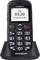 Schwarzes Mobiltelefon in Ladestation mit großen Tasten und Display, das '03:20, 01.03.2015 So' zeigt. Oben auf dem Display steht 'SIM'.