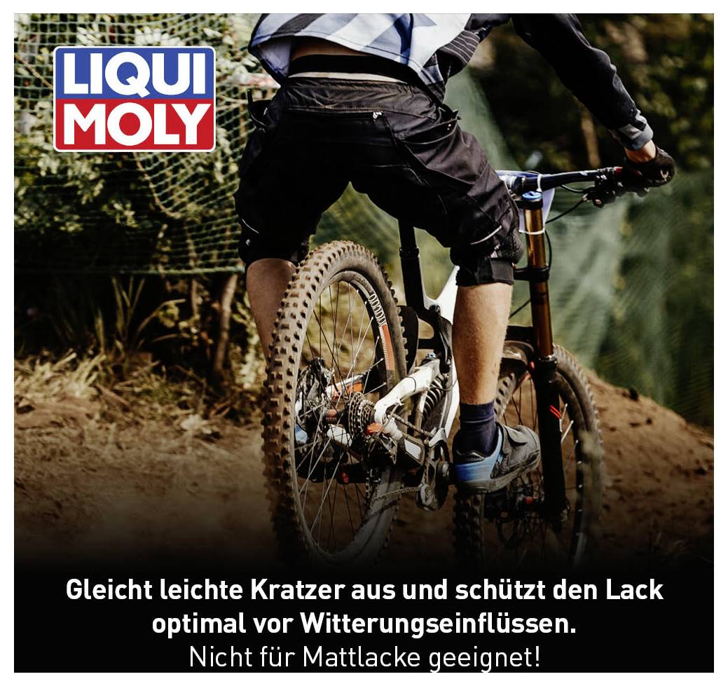 Ein Mountainbiker fährt bergab, umgeben von Bäumen. Oben links das Logo von 'LIQUI MOLY'. Unten Text: 'Schützt Lack optimal, nicht für Mattlacke'.
