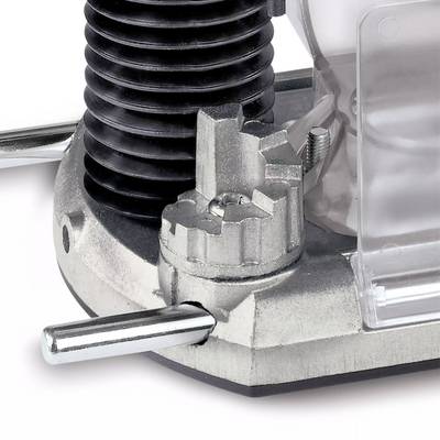 Ein Teil einer Metallmaschine mit einem Hebel und Zahnrädern. Der Hintergrund ist unscharf und zeigt weitere Maschinenelemente.