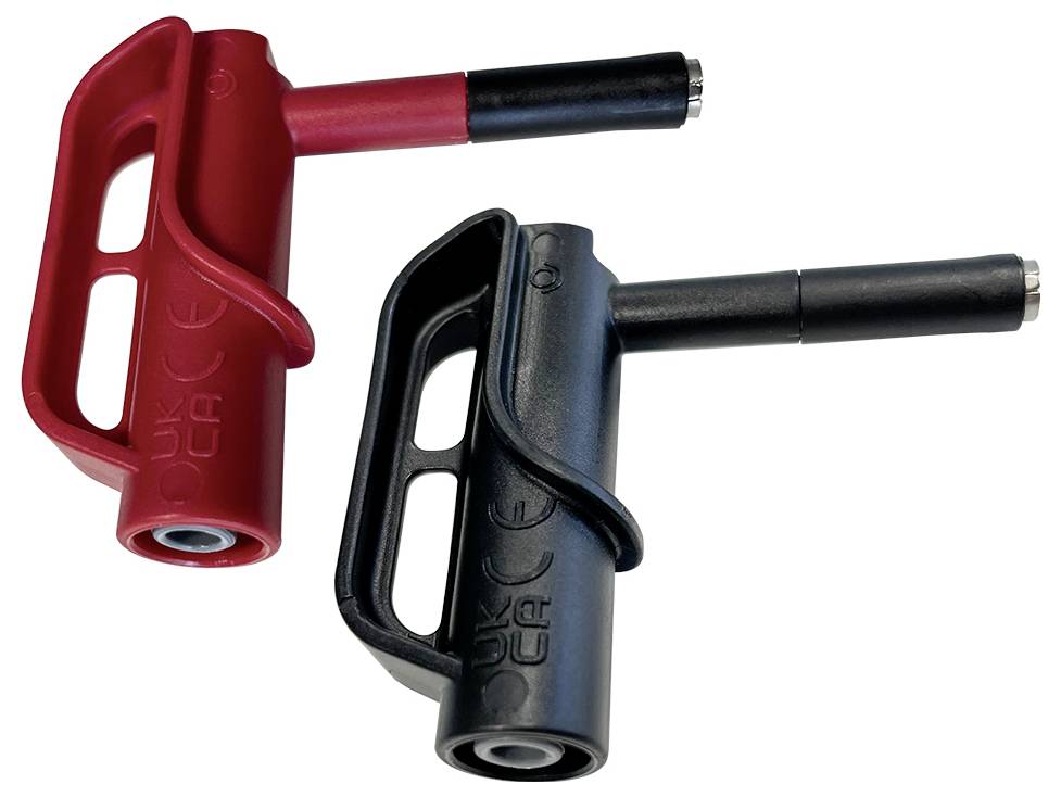 Zwei farbige Sicherheitsschalter, rot und schwarz, mit ergonomischem Griff und eingeprägten CE-Kennzeichnungen.